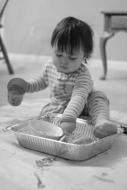 Busy Toddler Playing with Rice