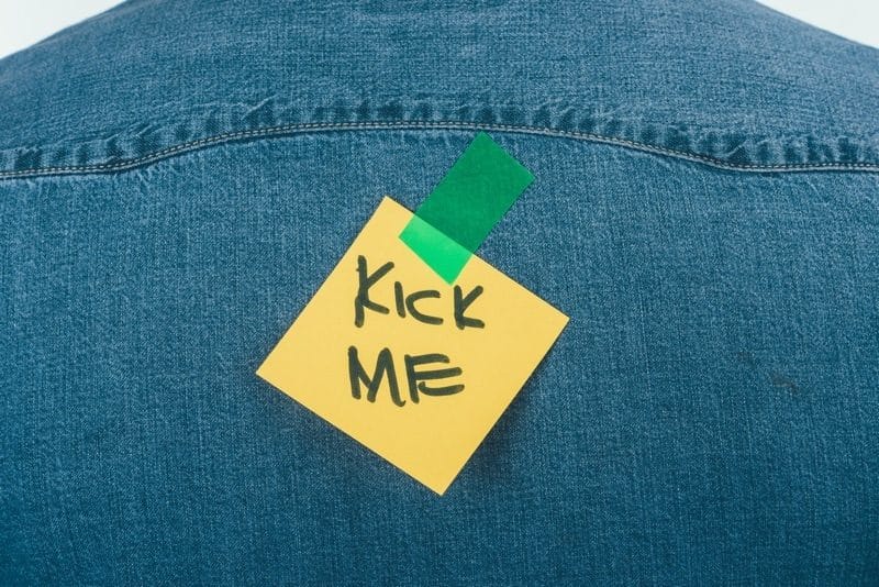 Kick me note taped on back